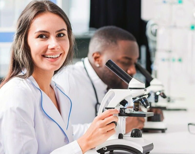 Image of two scientists working on Oligonucleotide Bioanalysis Challenges and Regulatory Solutions at Agilex Biolabs bioanalysis laboratory enviorenment.